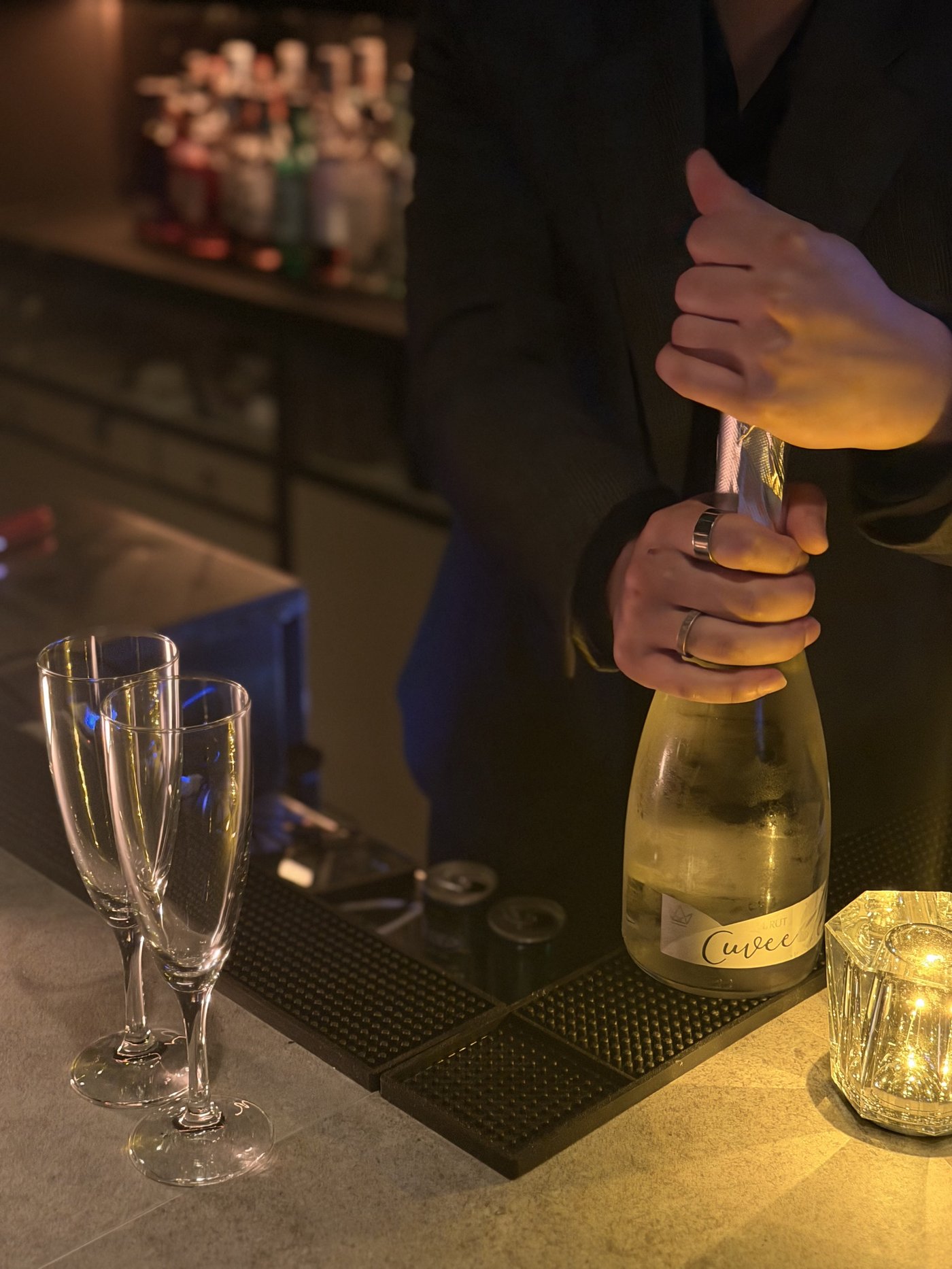 Champagne being opened at the counter