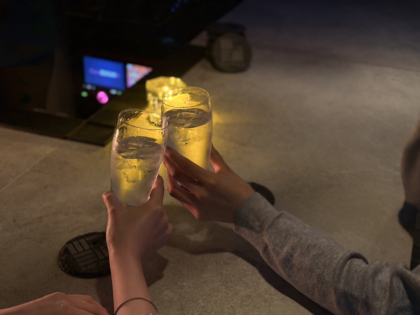 Clinking glasses over JENGA coasters